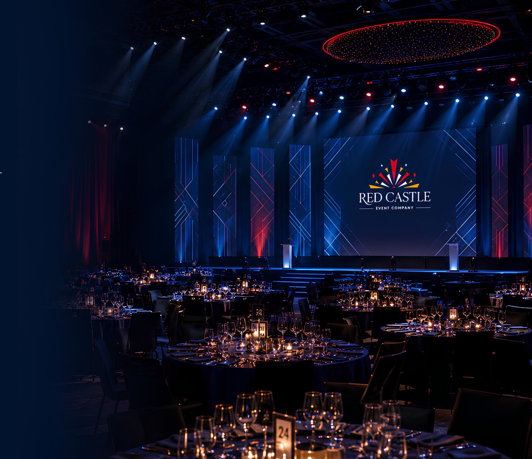 A candlelit banquet table set inside a darkened room before guests arrive
